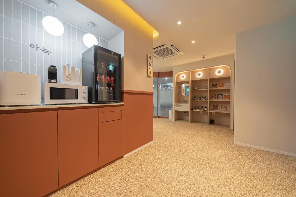 Kuchyň nebo kuchyňský kout v ubytování Aank Hotel Ilsan