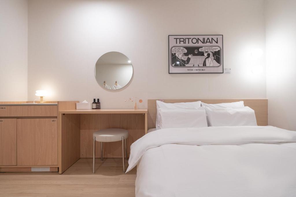 Postel nebo postele na pokoji v ubytování Aank Hotel Ilsan