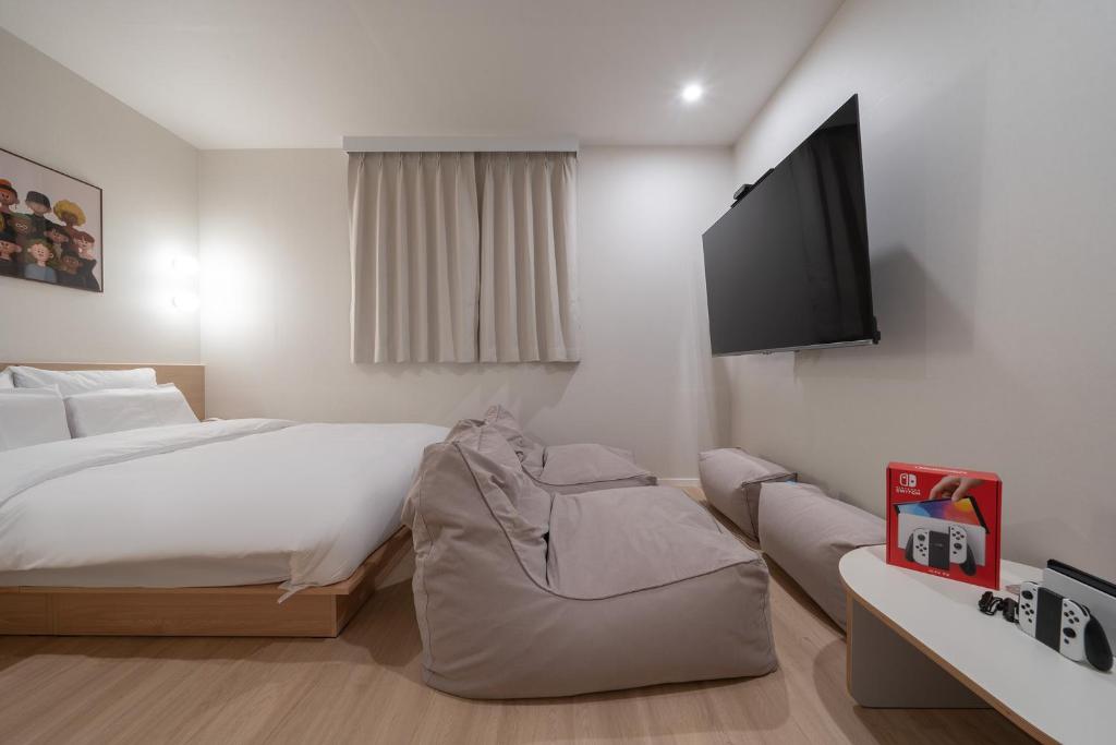 TV a/nebo společenská místnost v ubytování Aank Hotel Ilsan