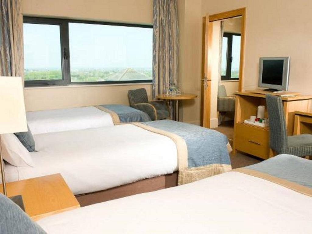 Postel nebo postele na pokoji v ubytování Green Isle Hotel, Dublin
