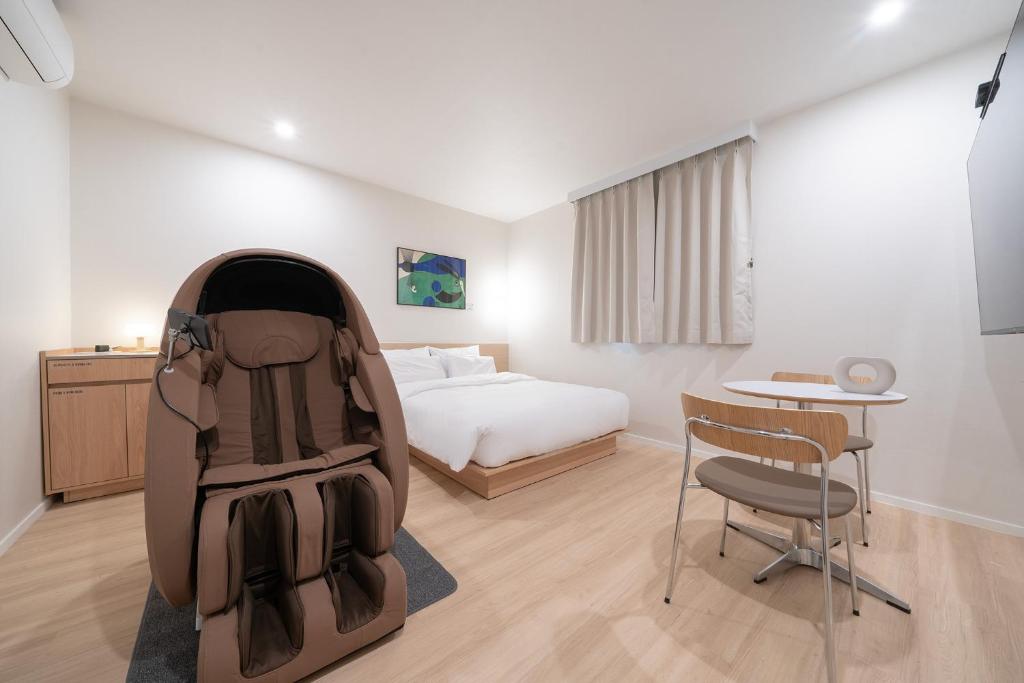 Postel nebo postele na pokoji v ubytování Aank Hotel Ilsan