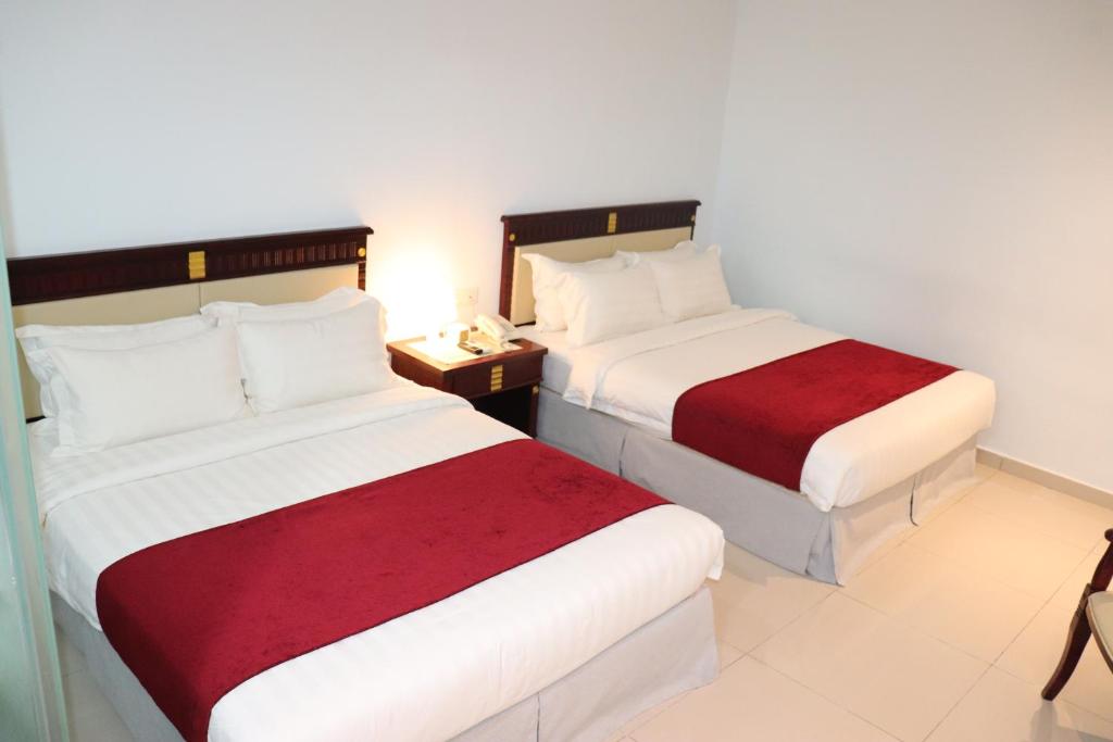 Postel nebo postele na pokoji v ubytování Hotel AL Amin