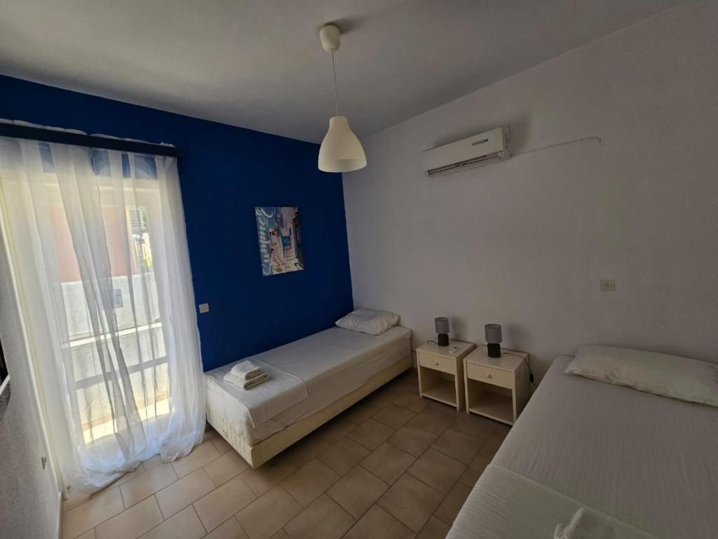 Posteľ alebo postele v izbe v ubytovaní Glyfada Apartment 91