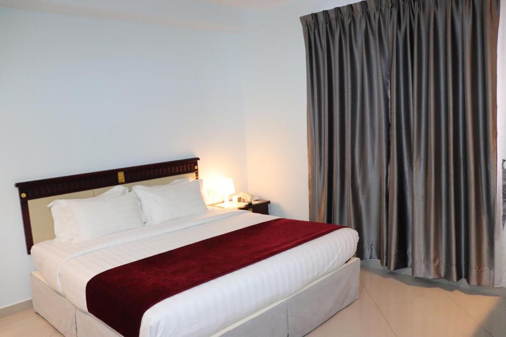 Postel nebo postele na pokoji v ubytování Hotel AL Amin