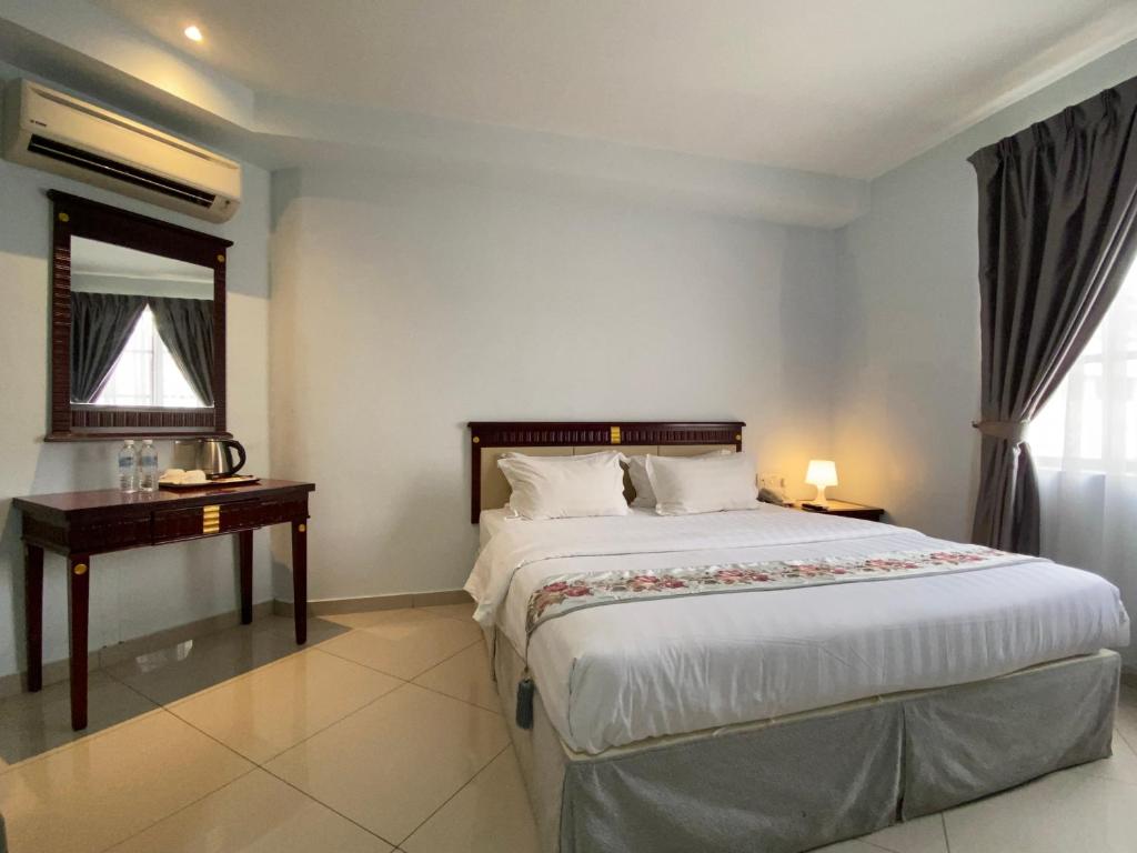 Postel nebo postele na pokoji v ubytování Hotel AL Amin