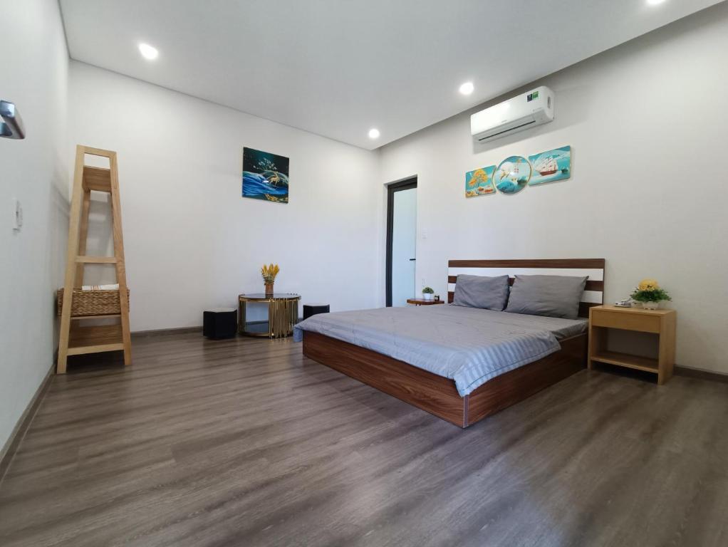 Postel nebo postele na pokoji v ubytování MyTran Homestay-HauLoan