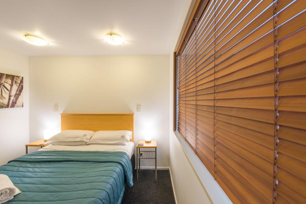 Postel nebo postele na pokoji v ubytování Roma On Riccarton Motel