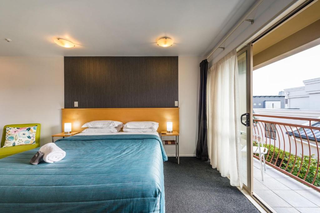 Postel nebo postele na pokoji v ubytování Roma On Riccarton Motel