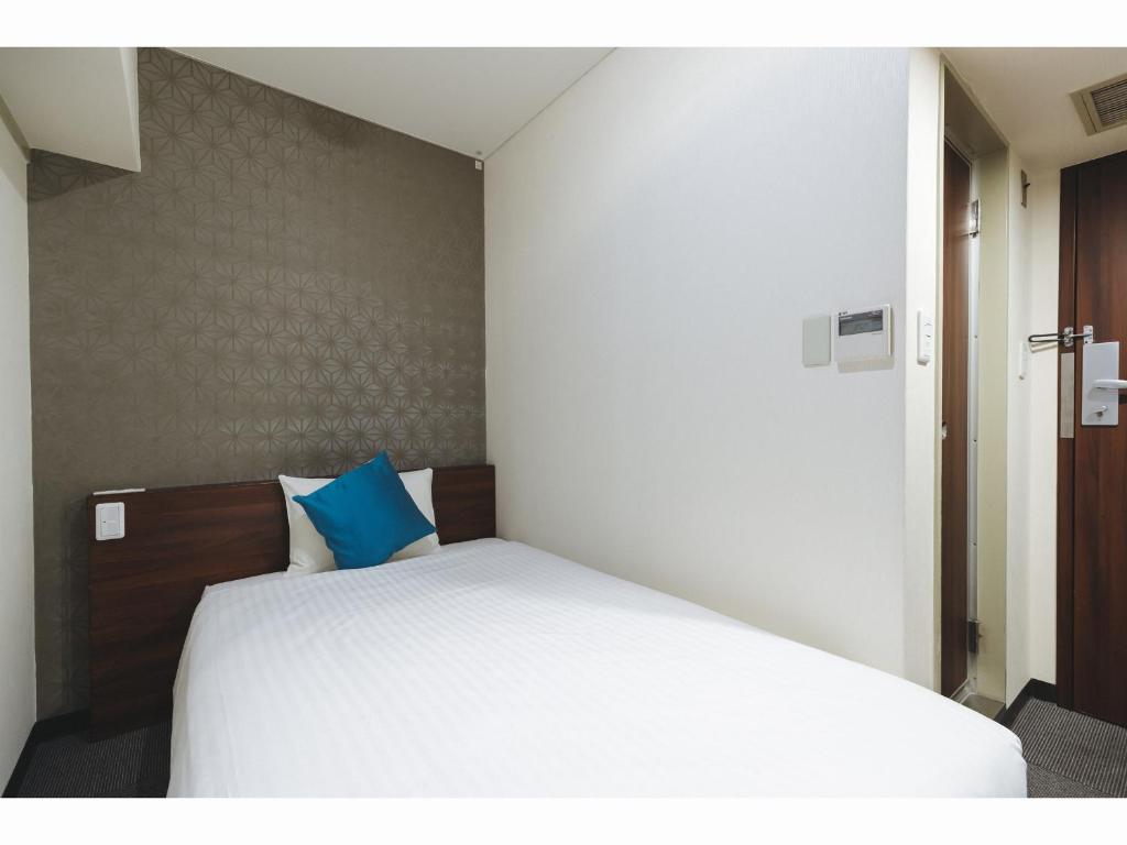 Postel nebo postele na pokoji v ubytování Cityroute Hotel