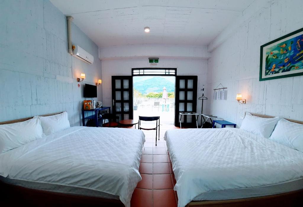 Postel nebo postele na pokoji v ubytování Kelly Field Homestay