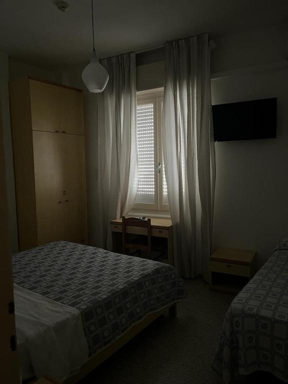 Postel nebo postele na pokoji v ubytování Hotel Annita Cervia