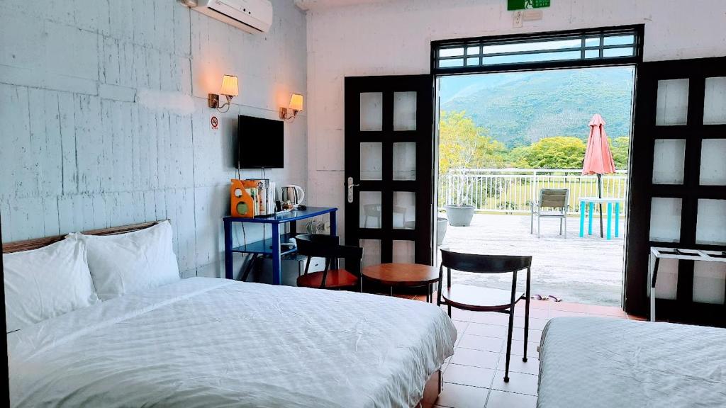Postel nebo postele na pokoji v ubytování Kelly Field Homestay