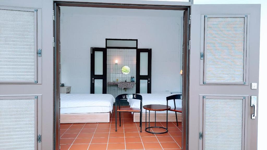 Postel nebo postele na pokoji v ubytování Kelly Field Homestay