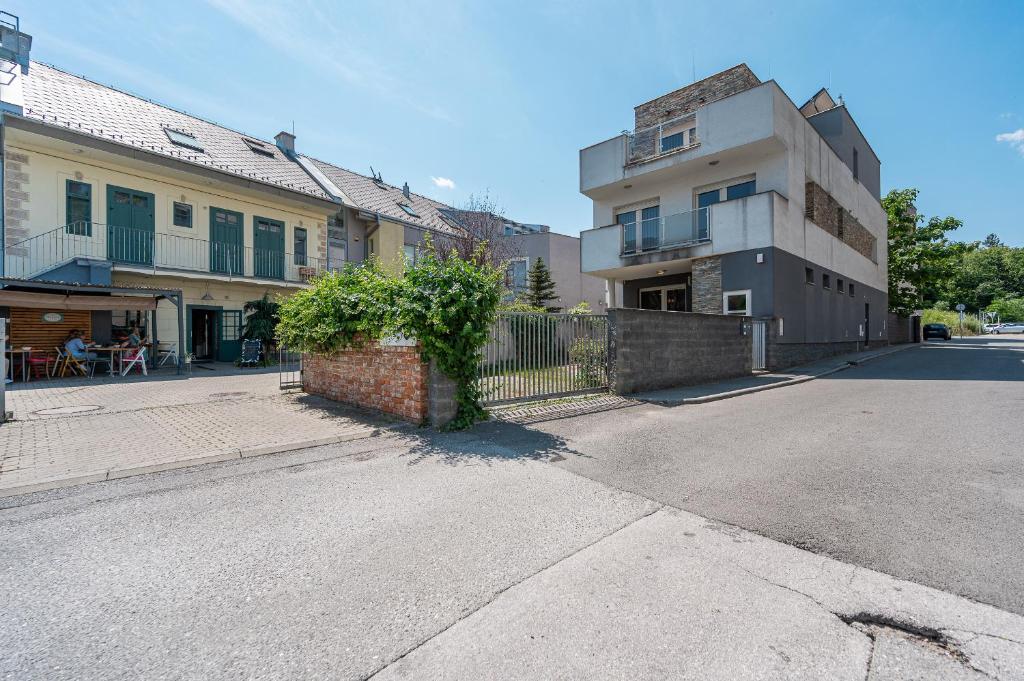 an empty street in front of a building at Family House Florian in Košice