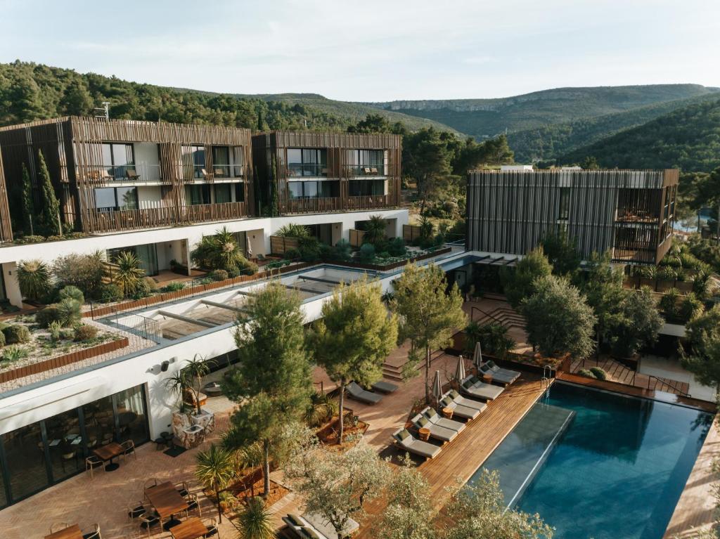 an aerial view of a building with a swimming pool at Maslina Resort in Stari Grad