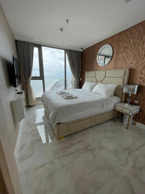 Postel nebo postele na pokoji v ubytování Copacabana jomtien beach high floor