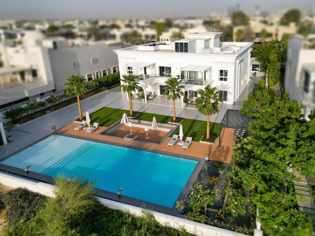 an aerial view of a house with a swimming pool at Villa Botanica-Exclusive 8-Bedroom Villa by Luxury Explorers' Collection in Dubai