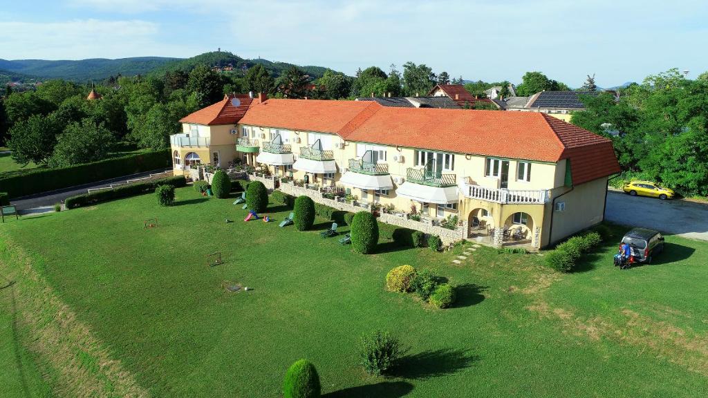 an aerial view of a large house on a field at Karát Panzió in Balatongyörök