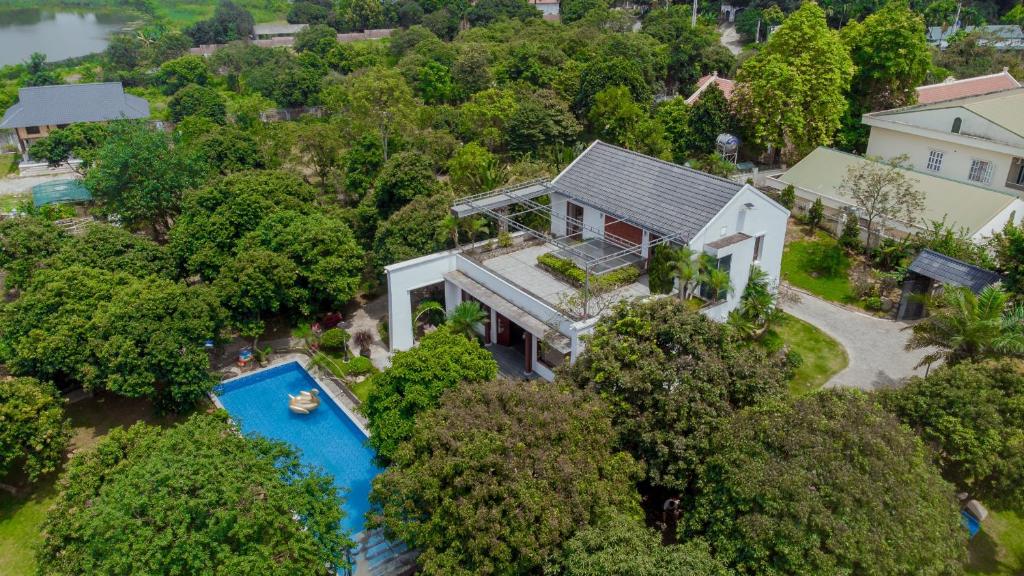 an aerial view of a house with a swimming pool at Green Hill Ba Vi Venuestay in Ba Vì