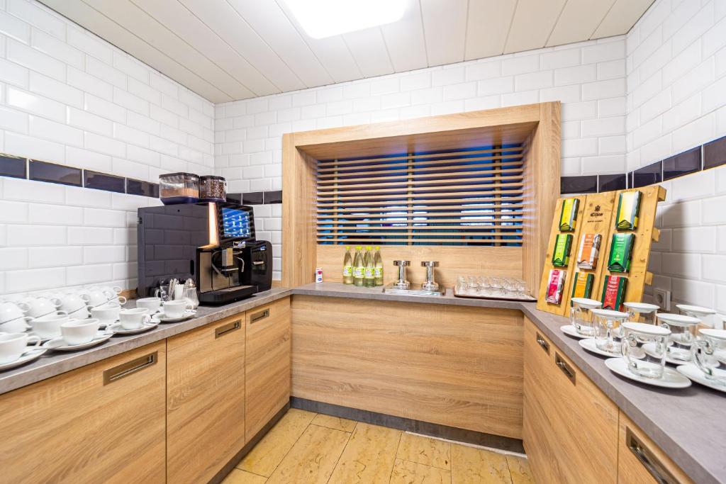 Kuchyň nebo kuchyňský kout v ubytování Hotel Franken