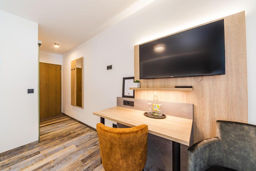 TV a/nebo společenská místnost v ubytování Hotel Franken