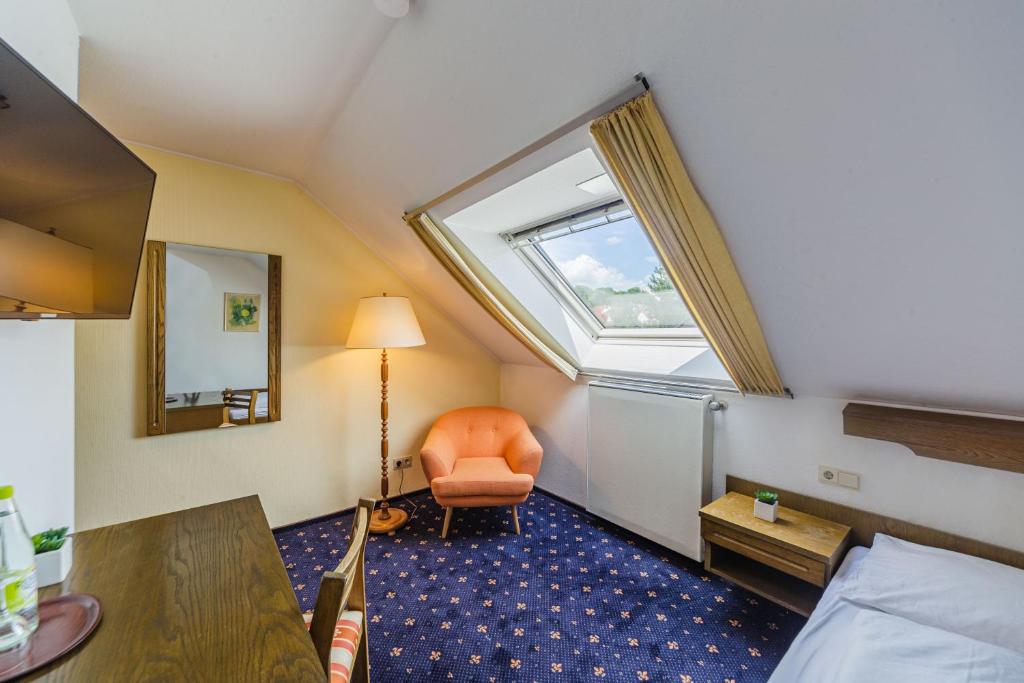 Postel nebo postele na pokoji v ubytování Hotel Franken