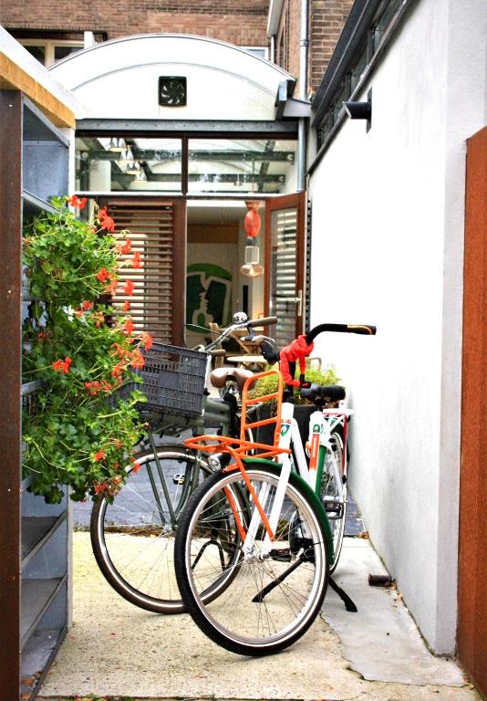two bikes are parked next to a building at Apartment close to campus in Nijmegen