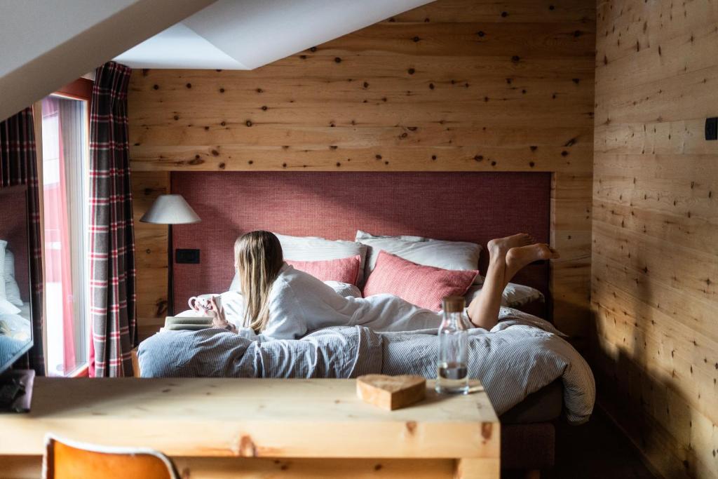 Postel nebo postele na pokoji v ubytování La Genzianella Bormio