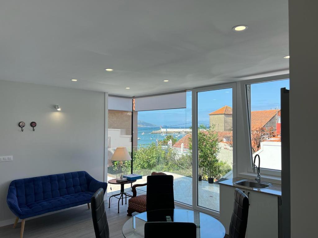 a living room with a view of the ocean at PASEO MARÍTIMO PANXON in Nigrán