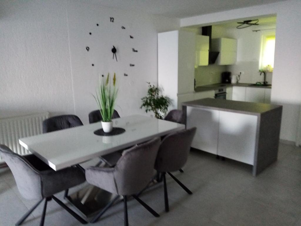 a kitchen and dining room with a table and chairs at NATALIJA - holiday house with garage in Sveti Juraj