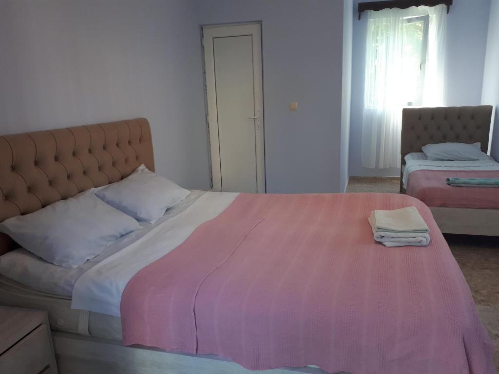 Postel nebo postele na pokoji v ubytování Guest house LIA