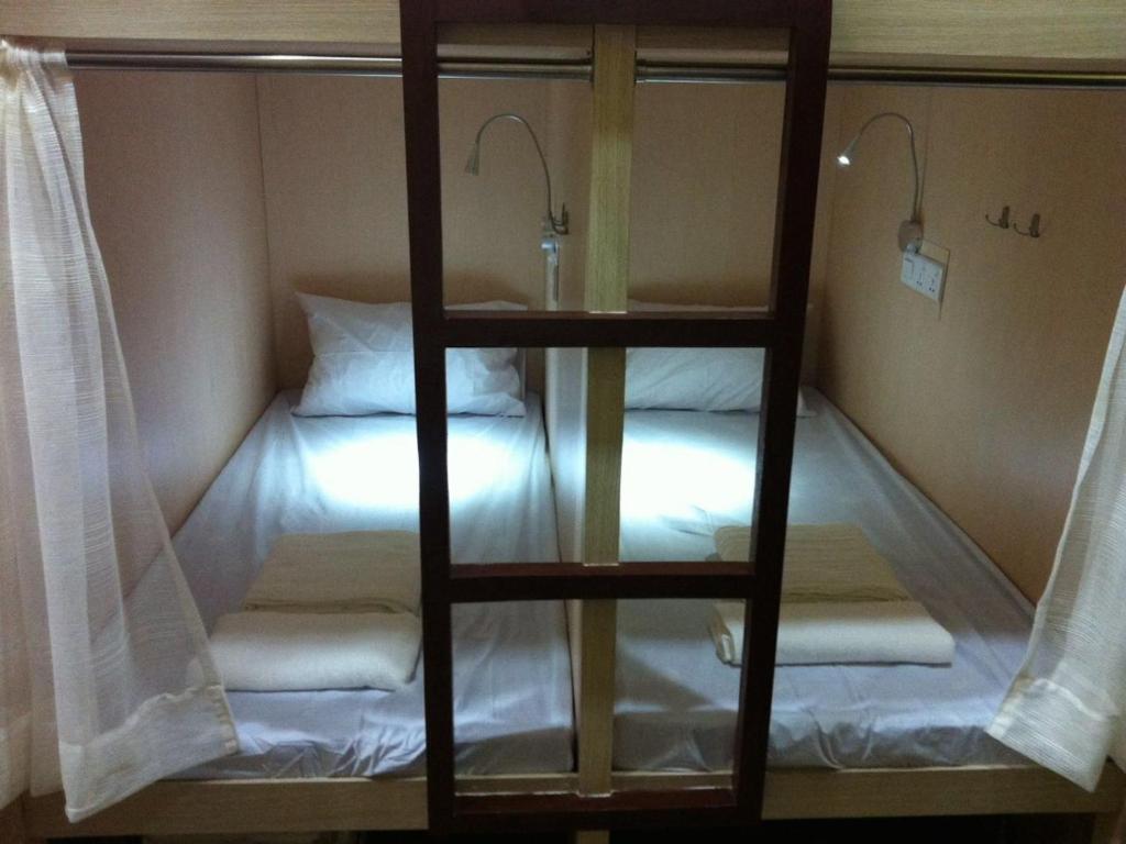 Postel nebo postele na pokoji v ubytování H2 Segama Backpacker
