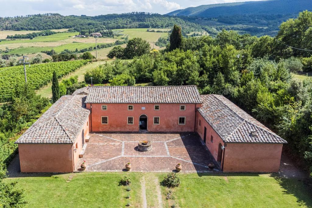 an aerial view of a building in a field at Villa Boschetto in Montepulciano