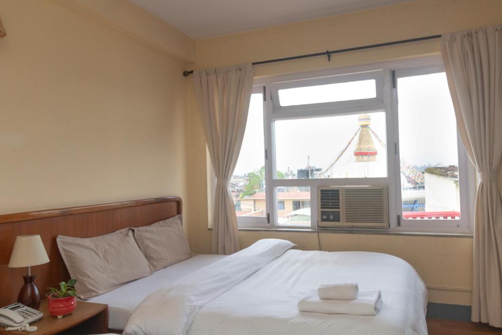 Postel nebo postele na pokoji v ubytování Hotel Sherwi Hyul