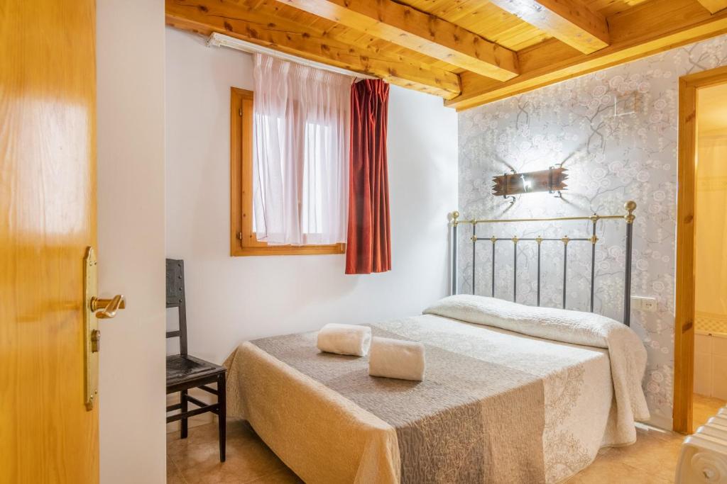 Tempat tidur dalam kamar di Casa Batlle Ginebro