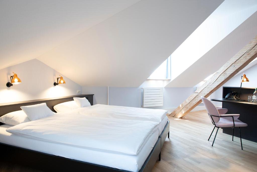 Postel nebo postele na pokoji v ubytování Hotel Schützen Rheinfelden