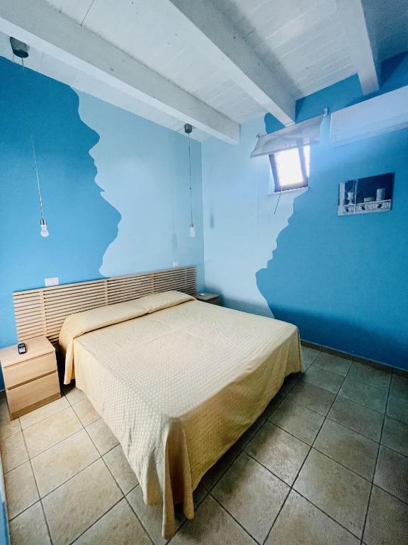 Rúm í herbergi á Borgo Camicia In