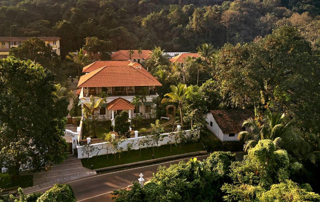 an aerial view of a house with a roof at amã Stays & Trails Hacienda De Bastora, Goa in Old Goa