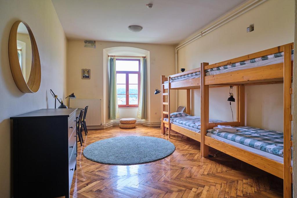 Postel nebo postele na pokoji v ubytování Samostan Mekinje