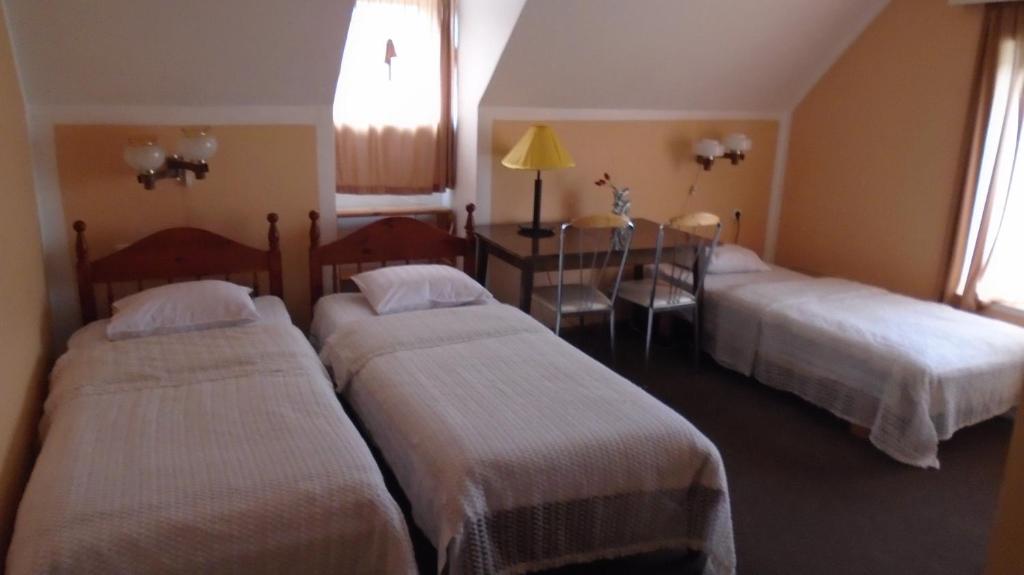 Postel nebo postele na pokoji v ubytování Hotel Getliin