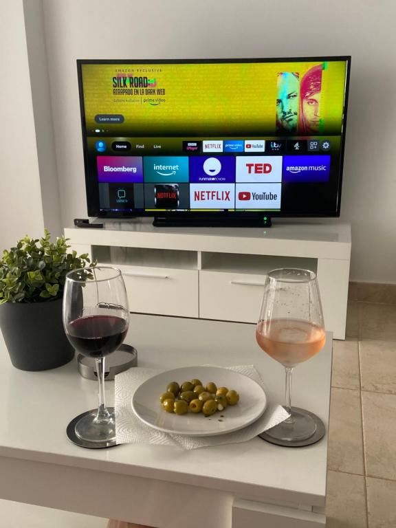 Televízia a/alebo spoločenská miestnosť v ubytovaní Casa Bello