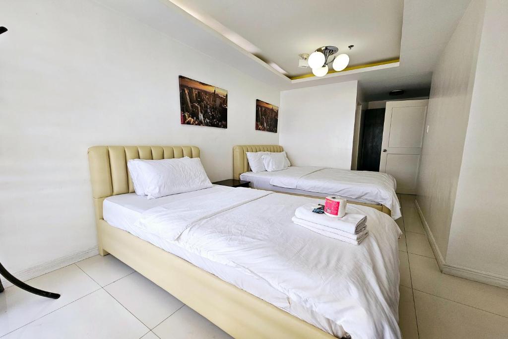 Katil atau katil-katil dalam bilik di Birchtower by Jeizel Manila City