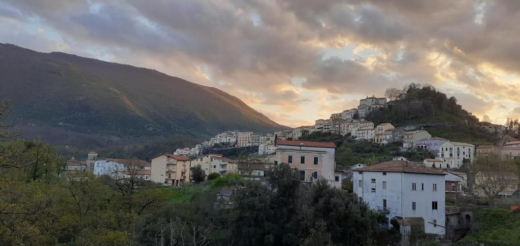 a group of buildings on a hill at sunset at B&B Borgo Revelia in Rivello