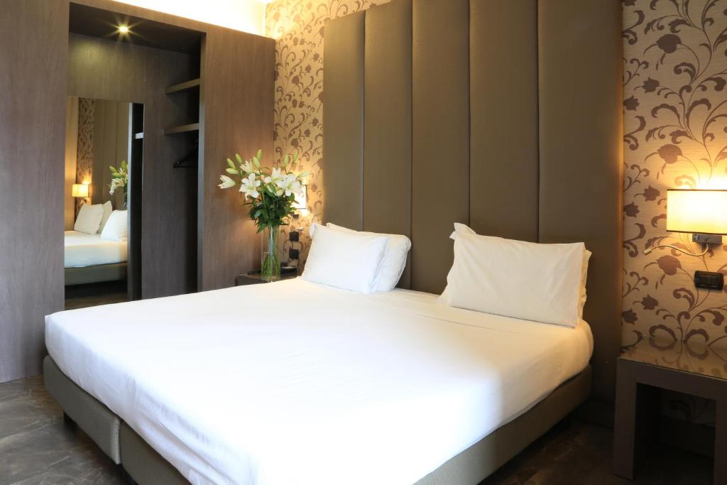 Postel nebo postele na pokoji v ubytování Klima Hotel Milano Fiere