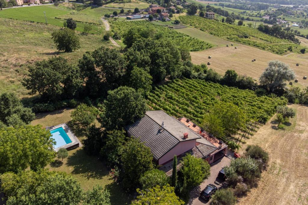 an aerial view of a farm house with a swimming pool at Exclusive Duplex Villa con piscina e vista in Strognano