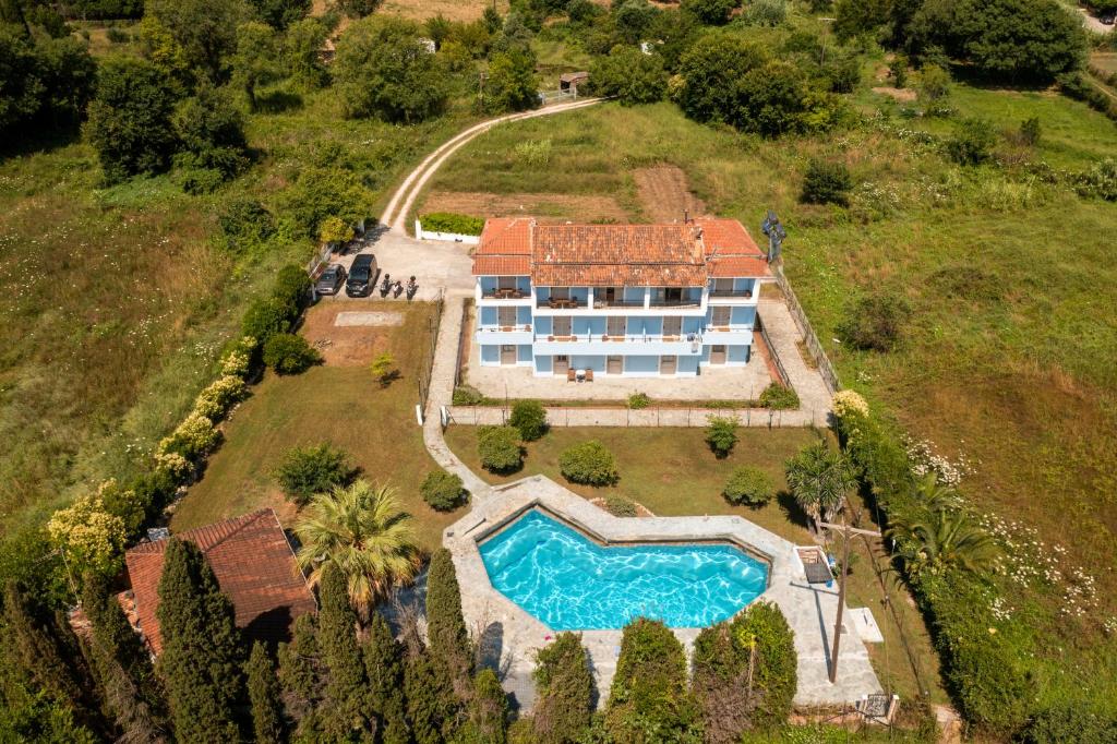 an aerial view of a house with a swimming pool at Apollo studios in Ýpsos