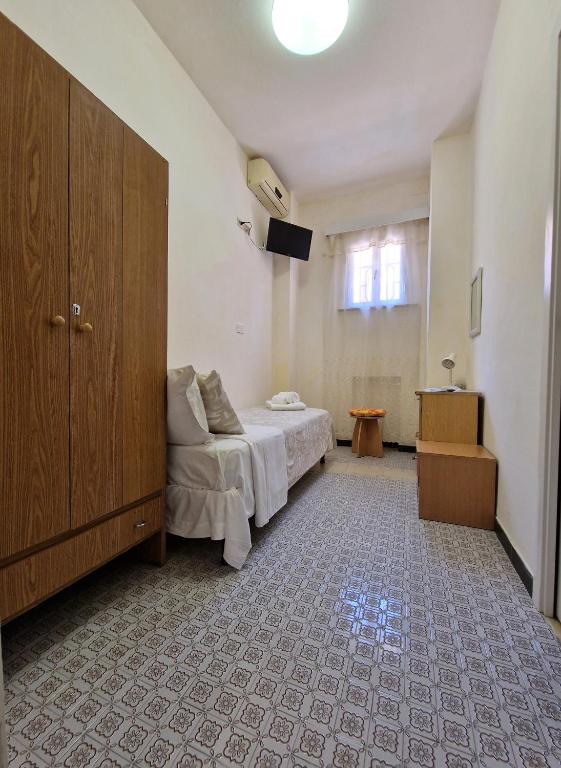 Postel nebo postele na pokoji v ubytování Hotel Rossella