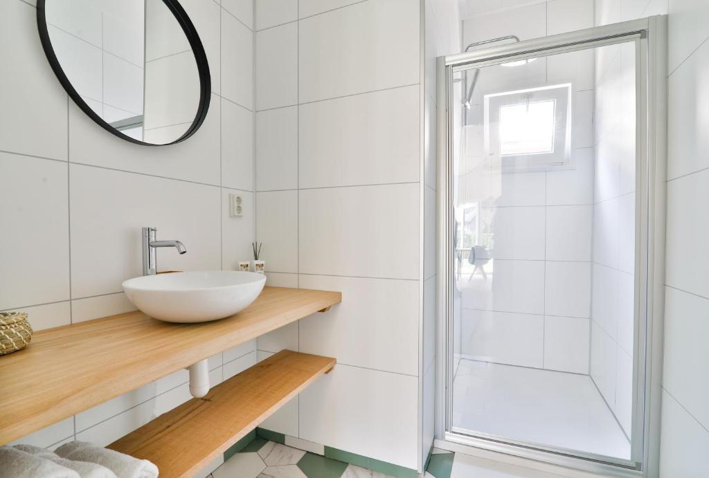 a bathroom with a sink and a shower at Buitenlede 7 - Suite M in Dwingeloo