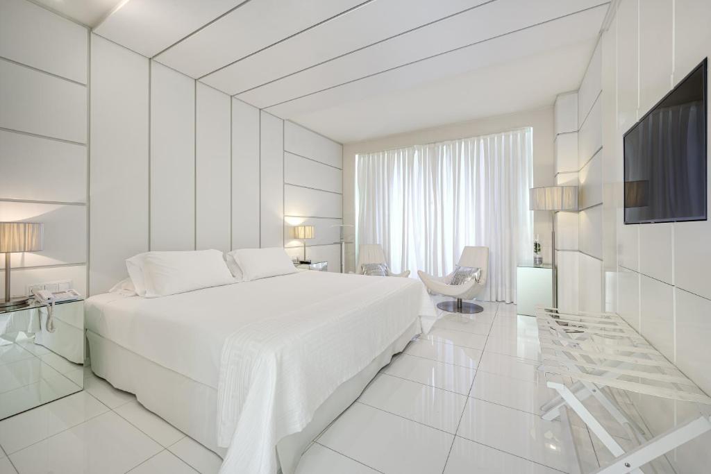 Postel nebo postele na pokoji v ubytování Hotel Nelva