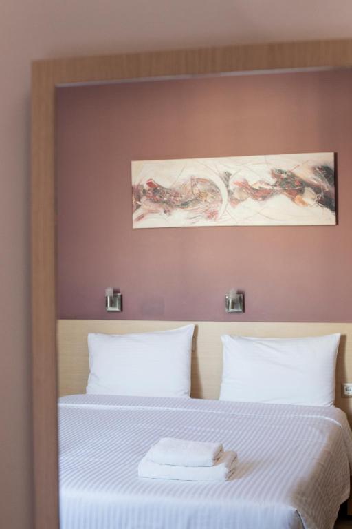Postel nebo postele na pokoji v ubytování Acropolis View Hotel